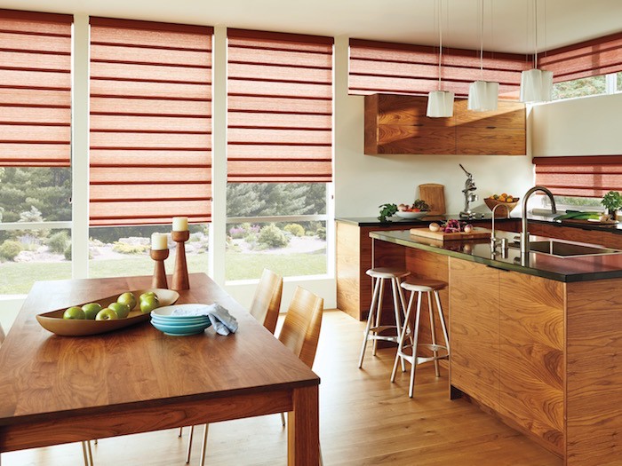 Wooden kitchen with table and chairs.